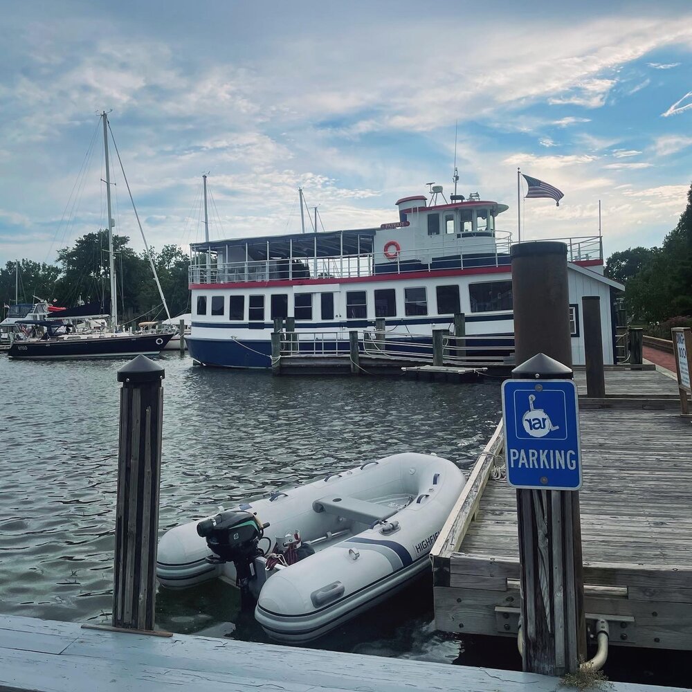 Rumpus (our dinghy) tied up at the public dock, next to Patriot (available for tours)