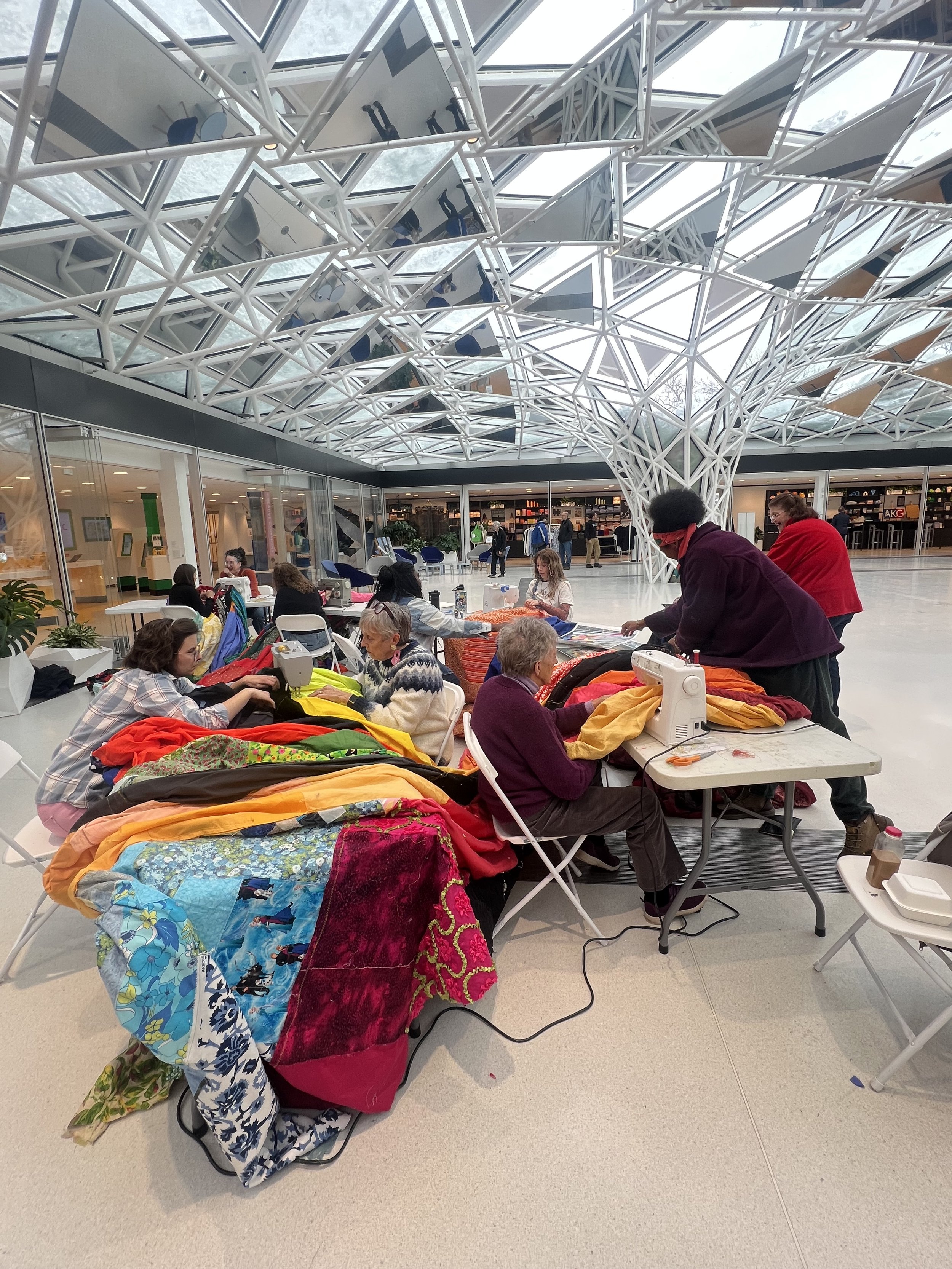 Public Sewing Days for Night Rainbow (2025) - Amanda Browder: Located at the Buffalo Art Museum AKG: part of the AKPublic Art Initiative exhibition Hi-Vis. All fabric is donated and built with the support and labor of the citizens of Buffalo, NY.