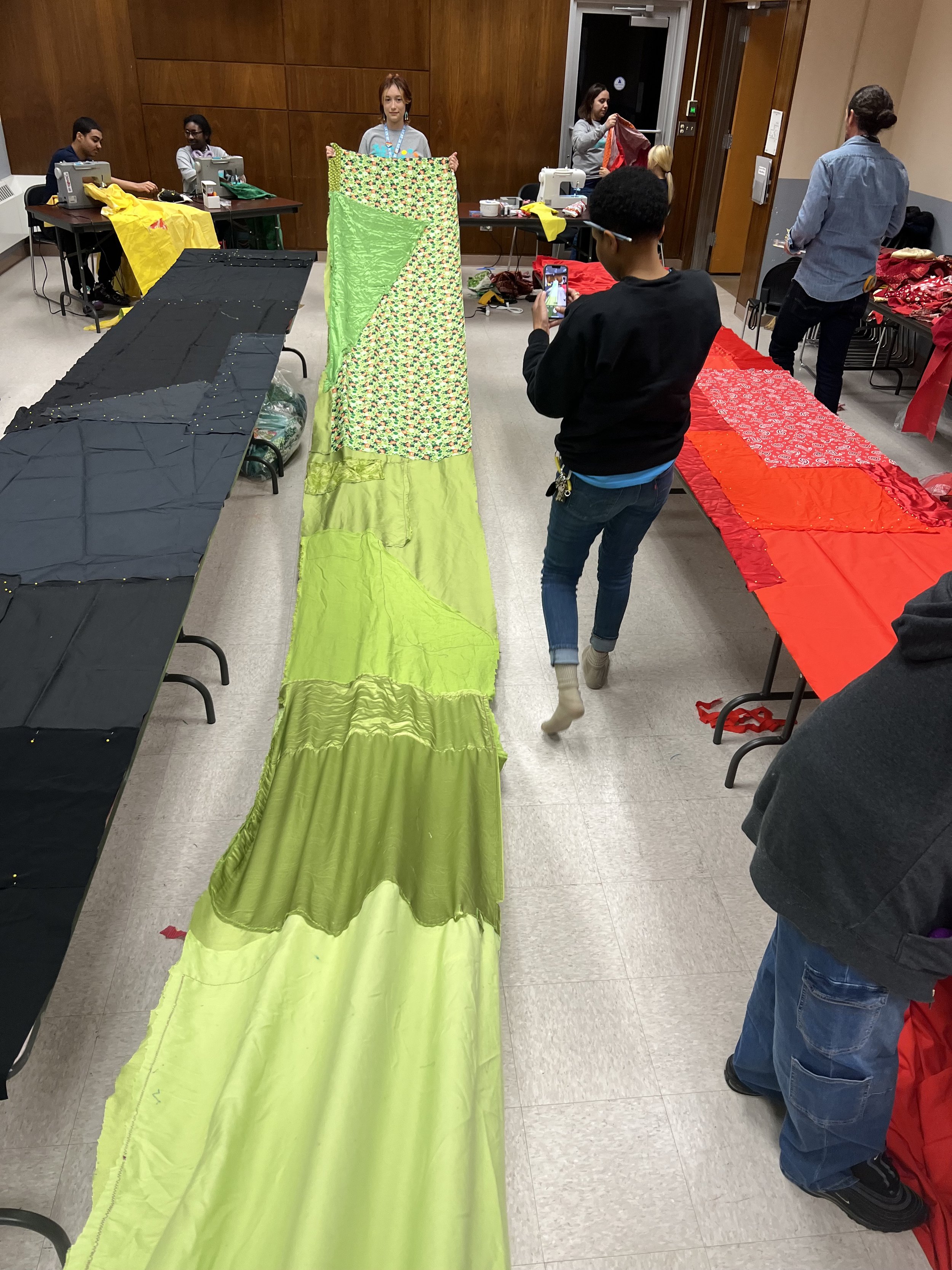 Public Sewing Days for Night Rainbow (2025) - Amanda Browder: Located at the Buffalo Art Museum AKG: part of the AKPublic Art Initiative exhibition Hi-Vis. All fabric is donated and built with the support and labor of the citizens of Buffalo, NY.