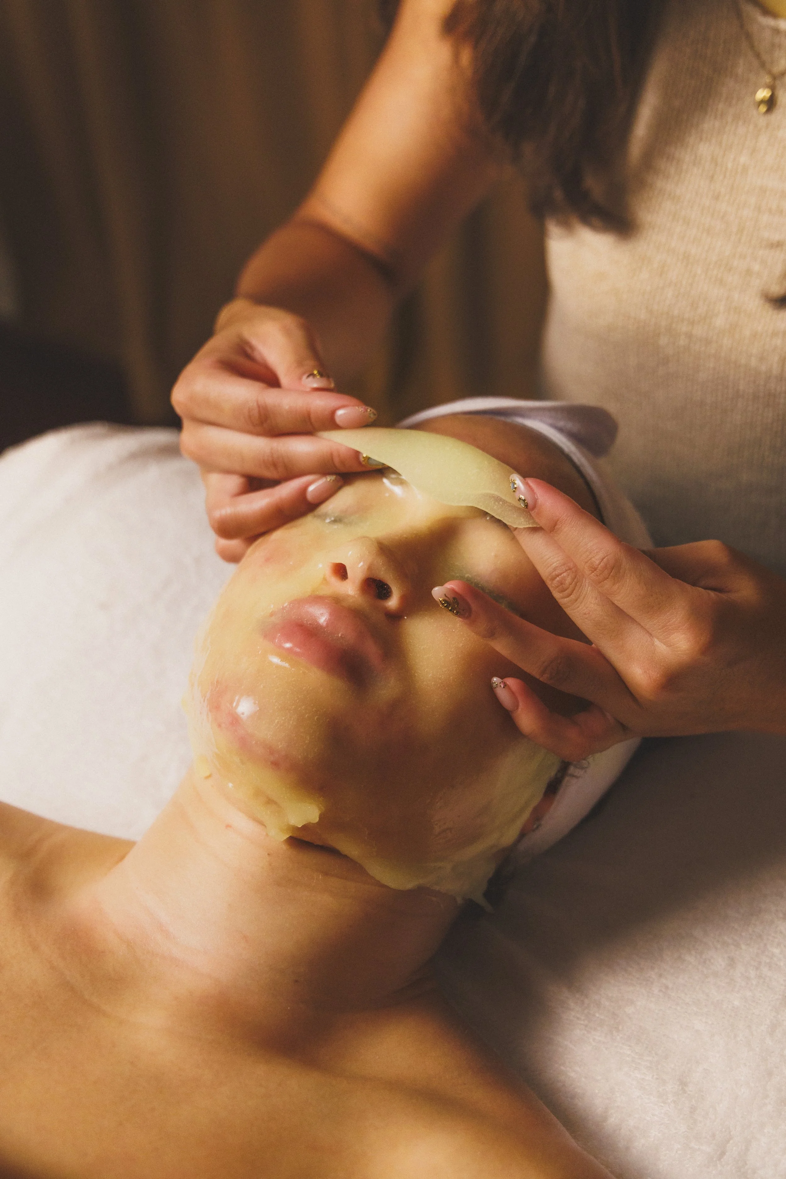 a picture of a client enjoying a moisture inducing mask leaving the skin glowing