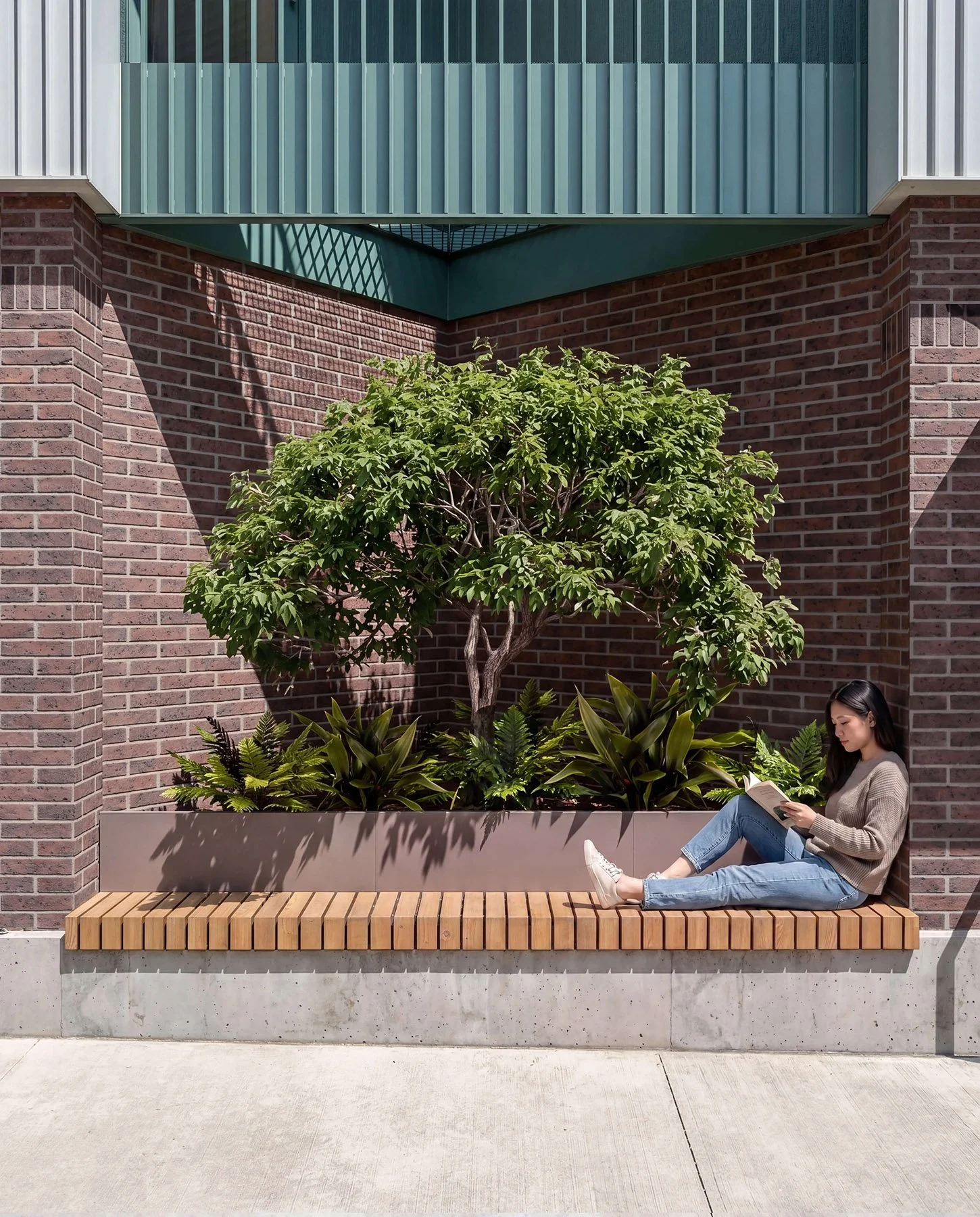 brick base, metal cladding and balcony structure at Arrowhead Residences architect design