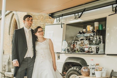 Wedding couple in front of coffee cart.jpeg