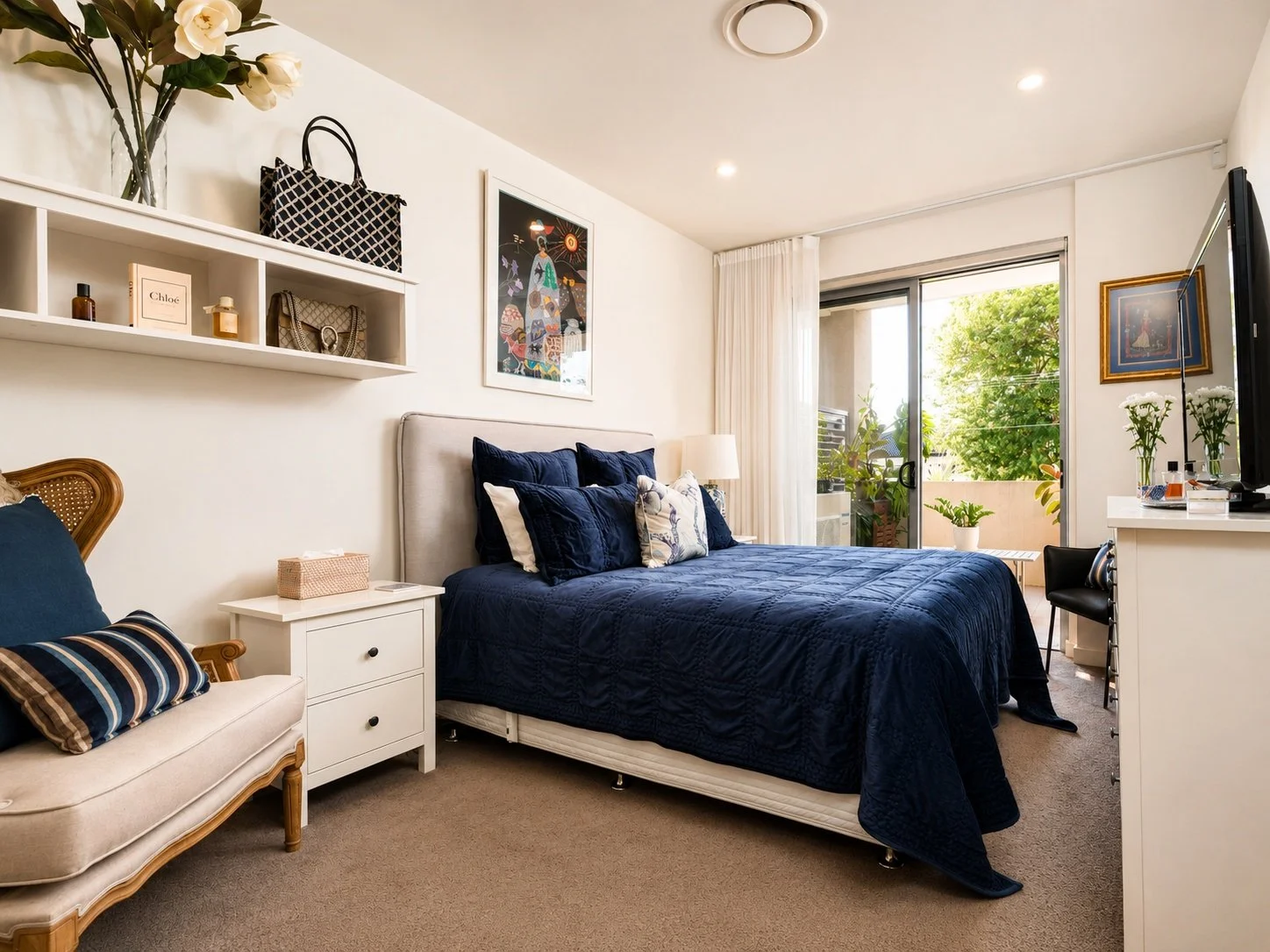 05_modern_bedroom_with_balcony_and_greenery.jpeg
