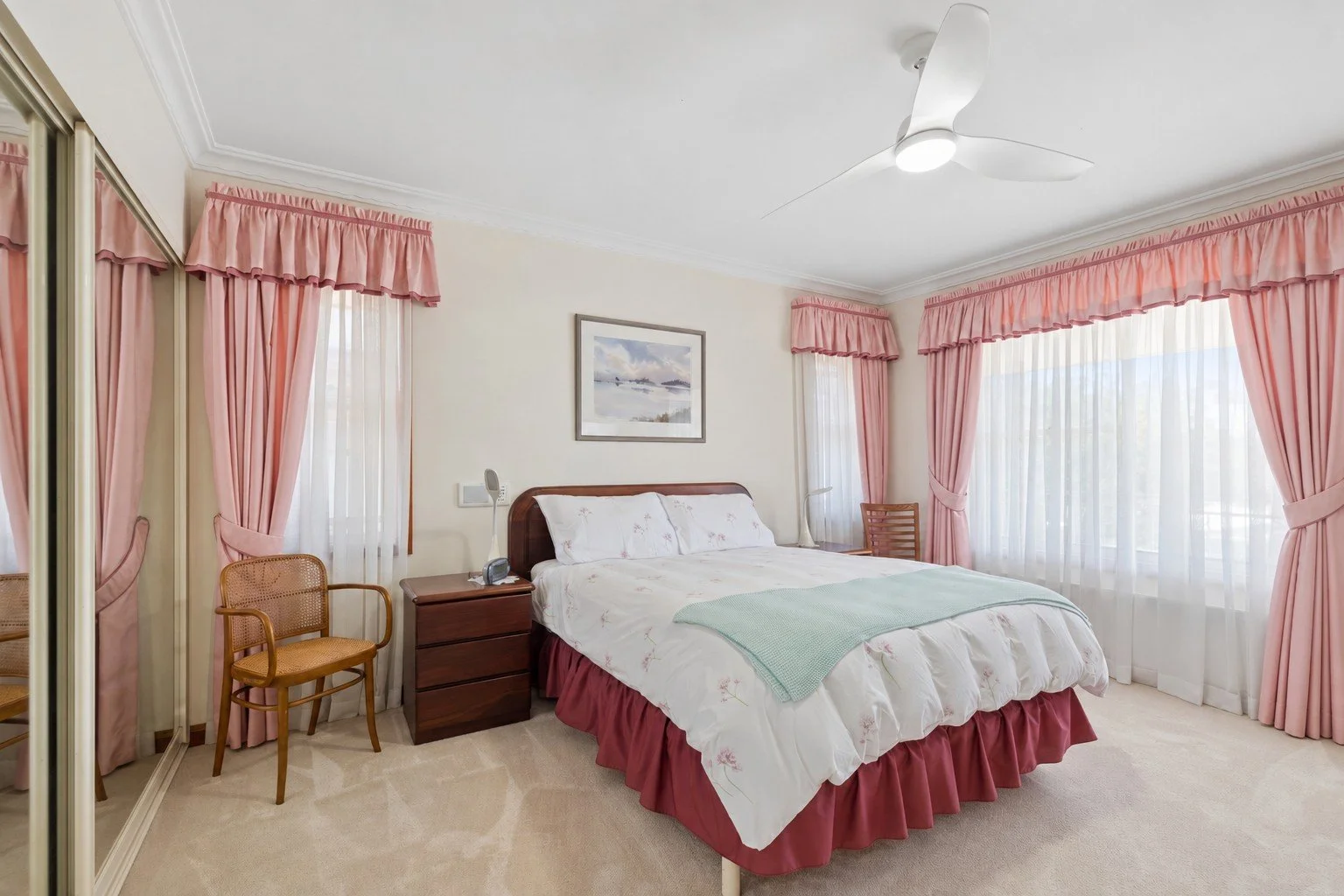 Cozy Pastel Bedroom with Coordinated Curtains.jpg