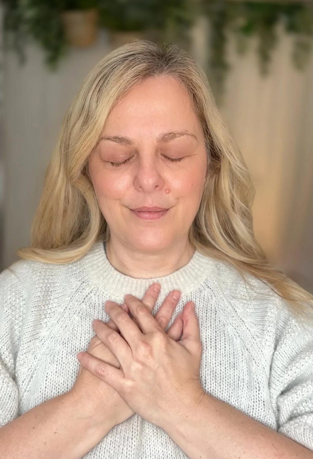 Sarah Pritchard demonstrating heart-centered somatic listening and nervous system co-regulation in her Shrewsbury therapy practice.