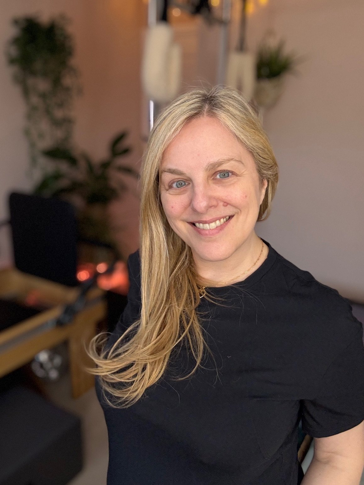 Sarah Pritchard Master Somatic Movement Therapist and Educator and Specialist in somatic movement standing in her virtual studio embodying calm, presence and professional expertise