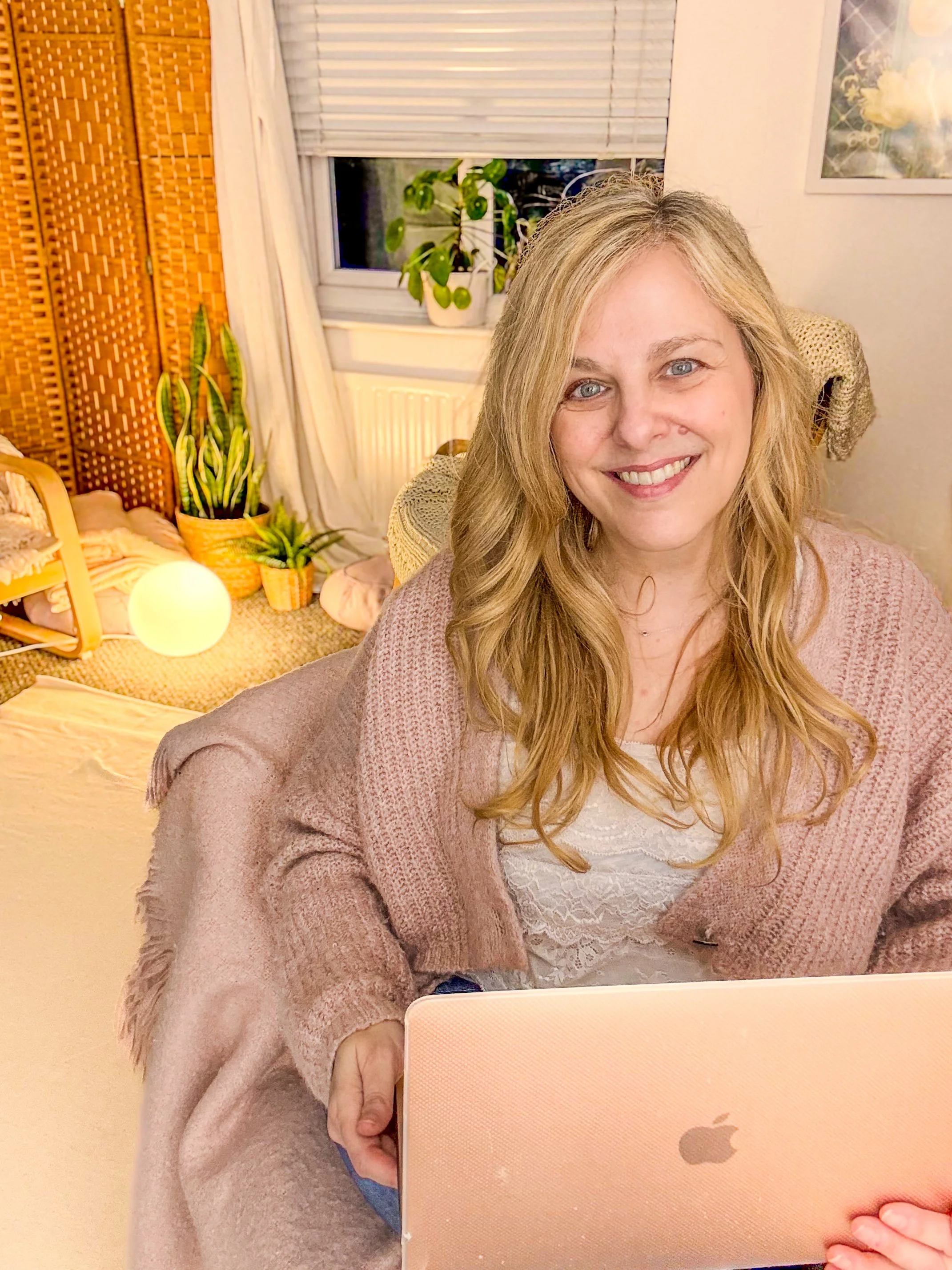 Sarah Pritchard, a Master Somatic Movement Therapist, providing virtual 1:1 SomaSoul therapy sessions via Zoom from her cozy, regulated studio.