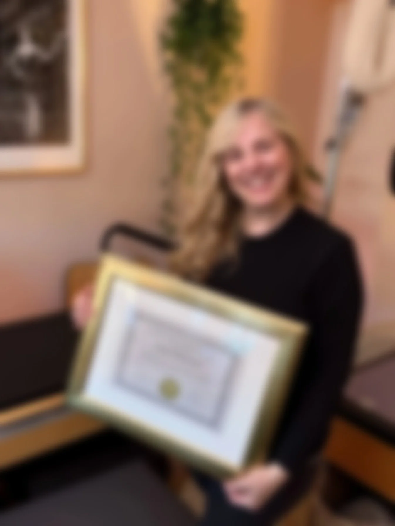 Sarah Pritchard displaying her ISMETA Master Somatic Movement Therapist and Educator (MSMT/MSME) certificate, demonstrating highest-level expertise and international accreditation in regulated somatics.