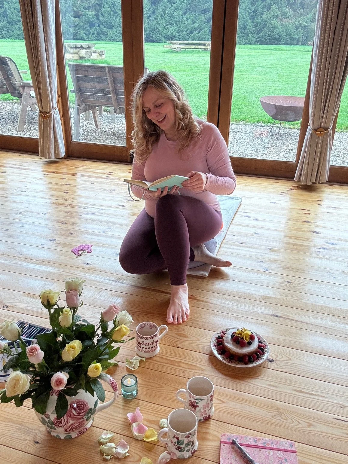 Sarah Pritchard, ISMETA Master and Somatic Therapist, reading at Newton Meadows Garden Room. A tranquil setting for exploring nervous system regulation, psoas health, and somatic movement through her blog.