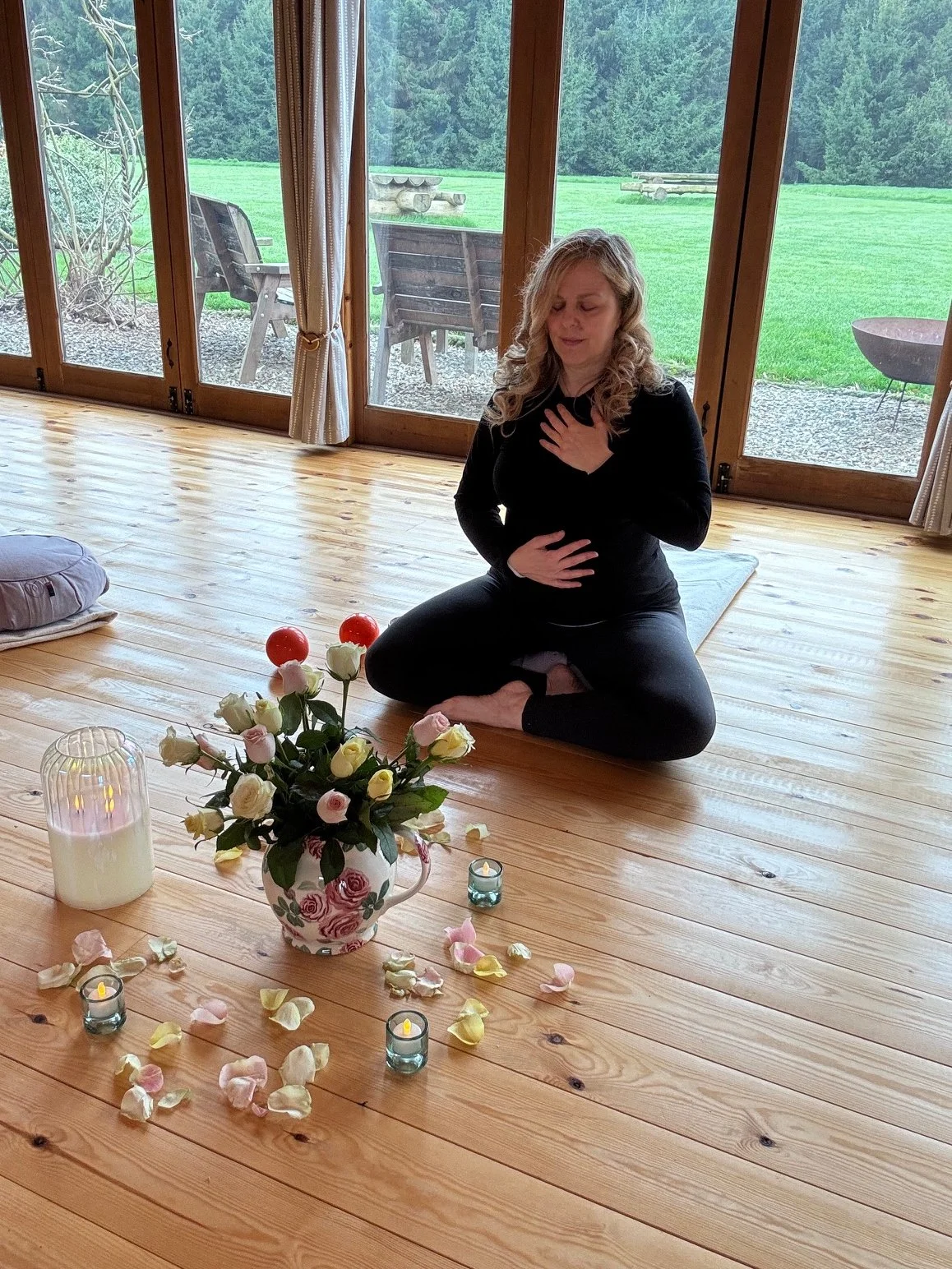 Sarah Pritchard MSMT MSME, ISMETA Master Somatic Educator, demonstrating a heart-gut vagus nerve regulation embodiment practice at Newton Meadows in Shropshire.