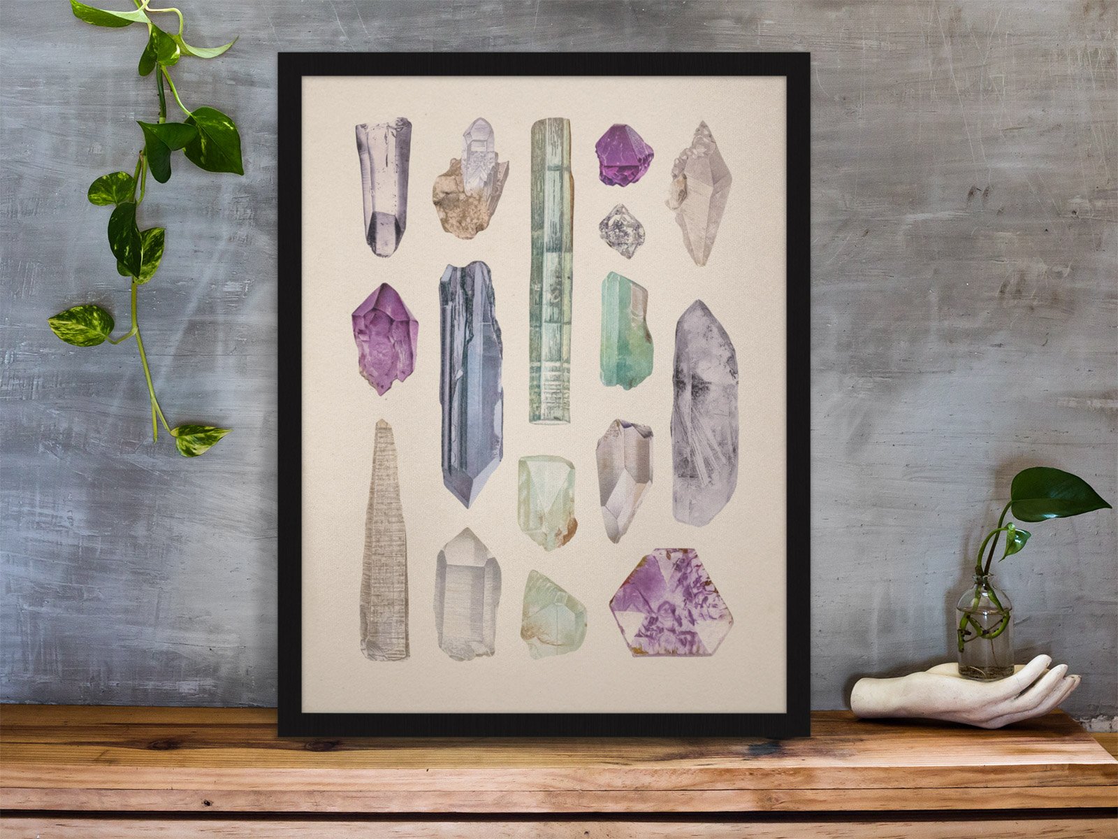 framed-art-print-standing-on-a-wooden-desk-against-a-concrete-wall-near-a-hand-decoration-a10403 (6).jpeg