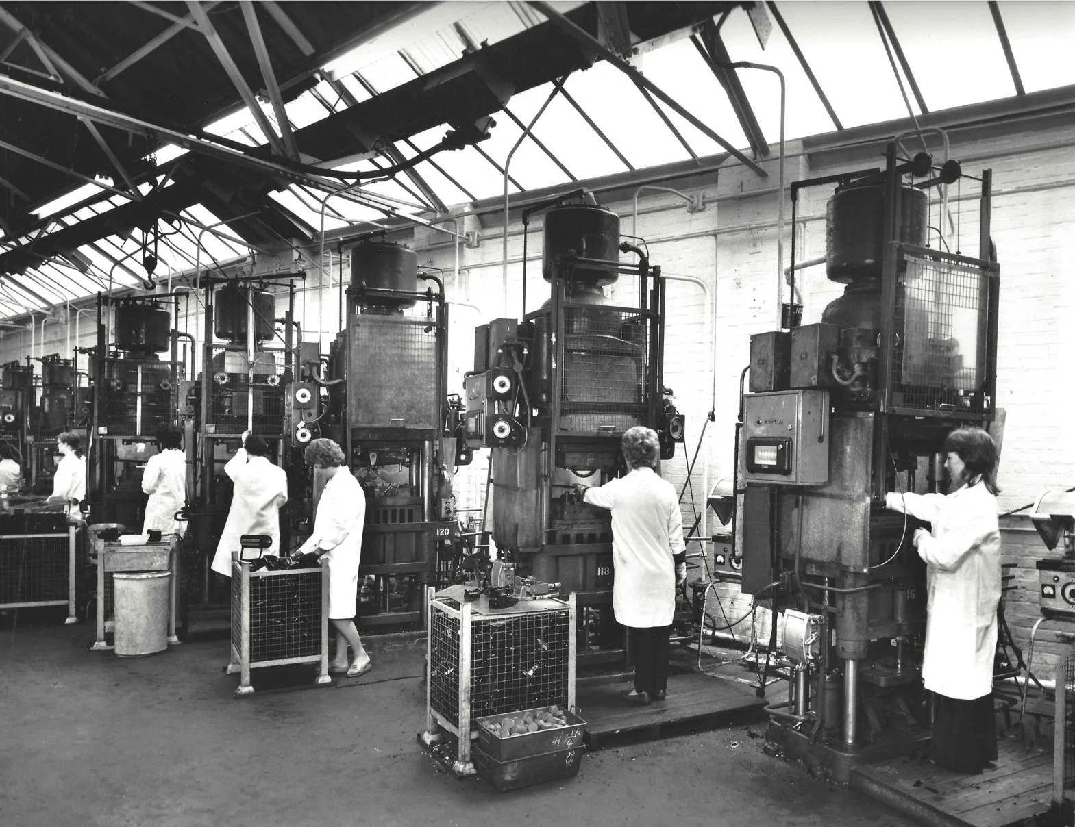 Women at machine presses 2