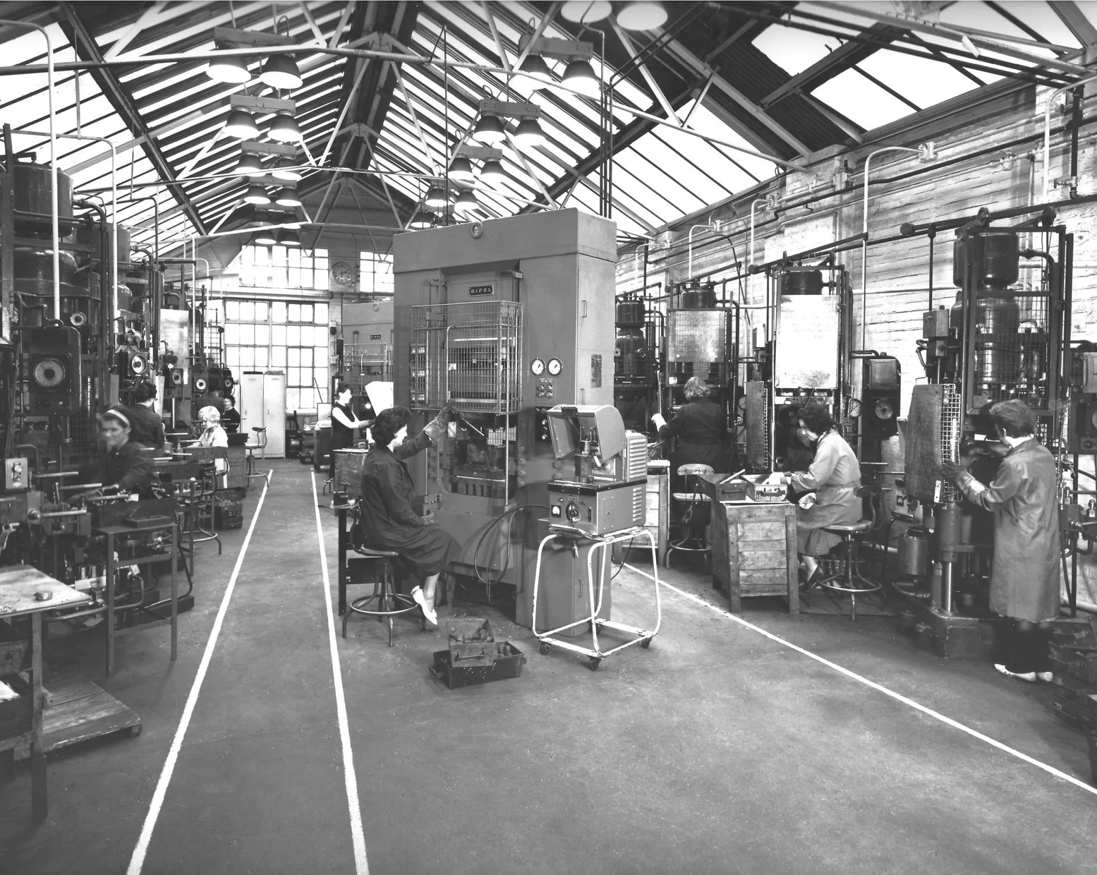 Women at machine presses