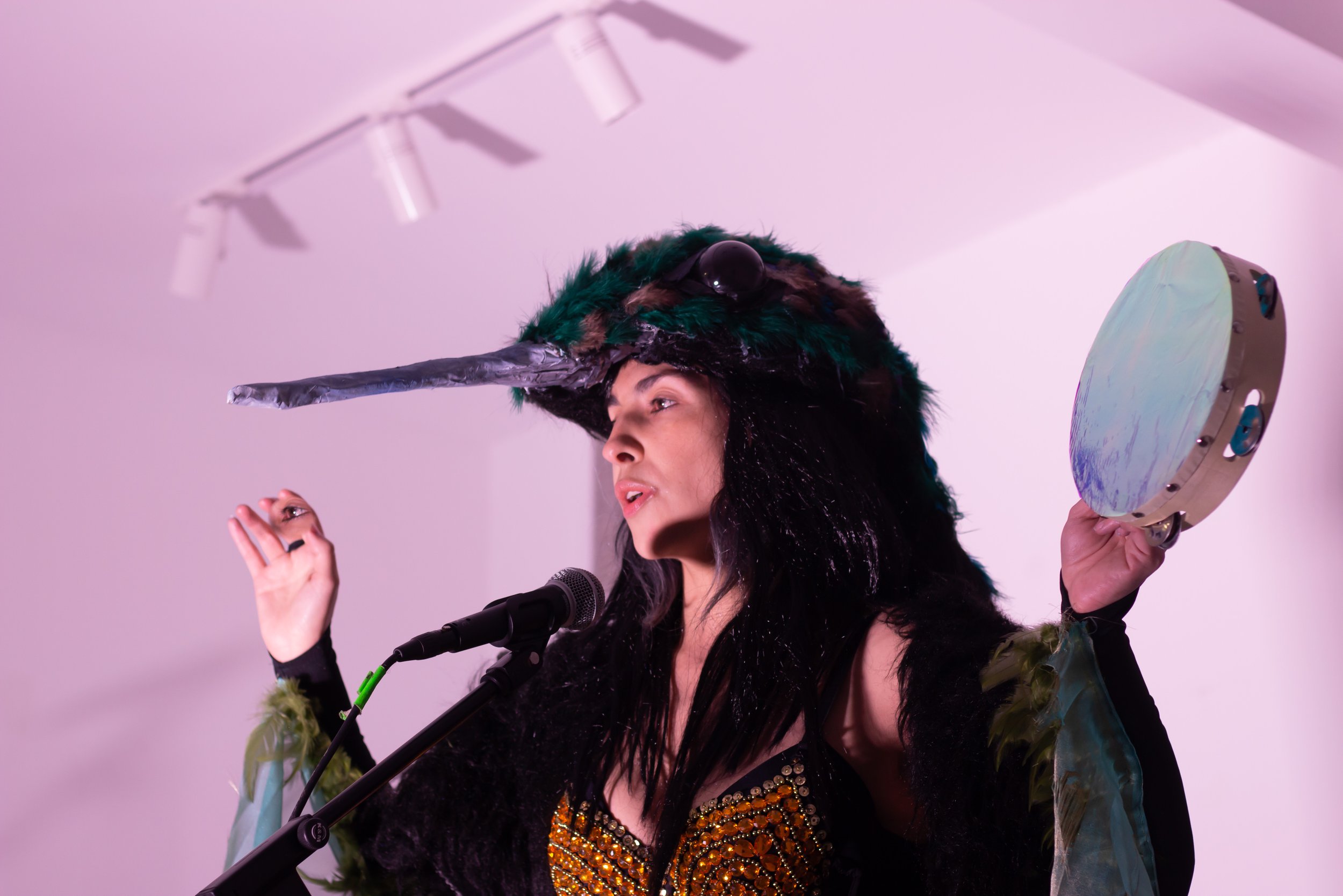 Paola Estrella performing “Embodying a Hummingbird” at “The Enigma of Arrival”