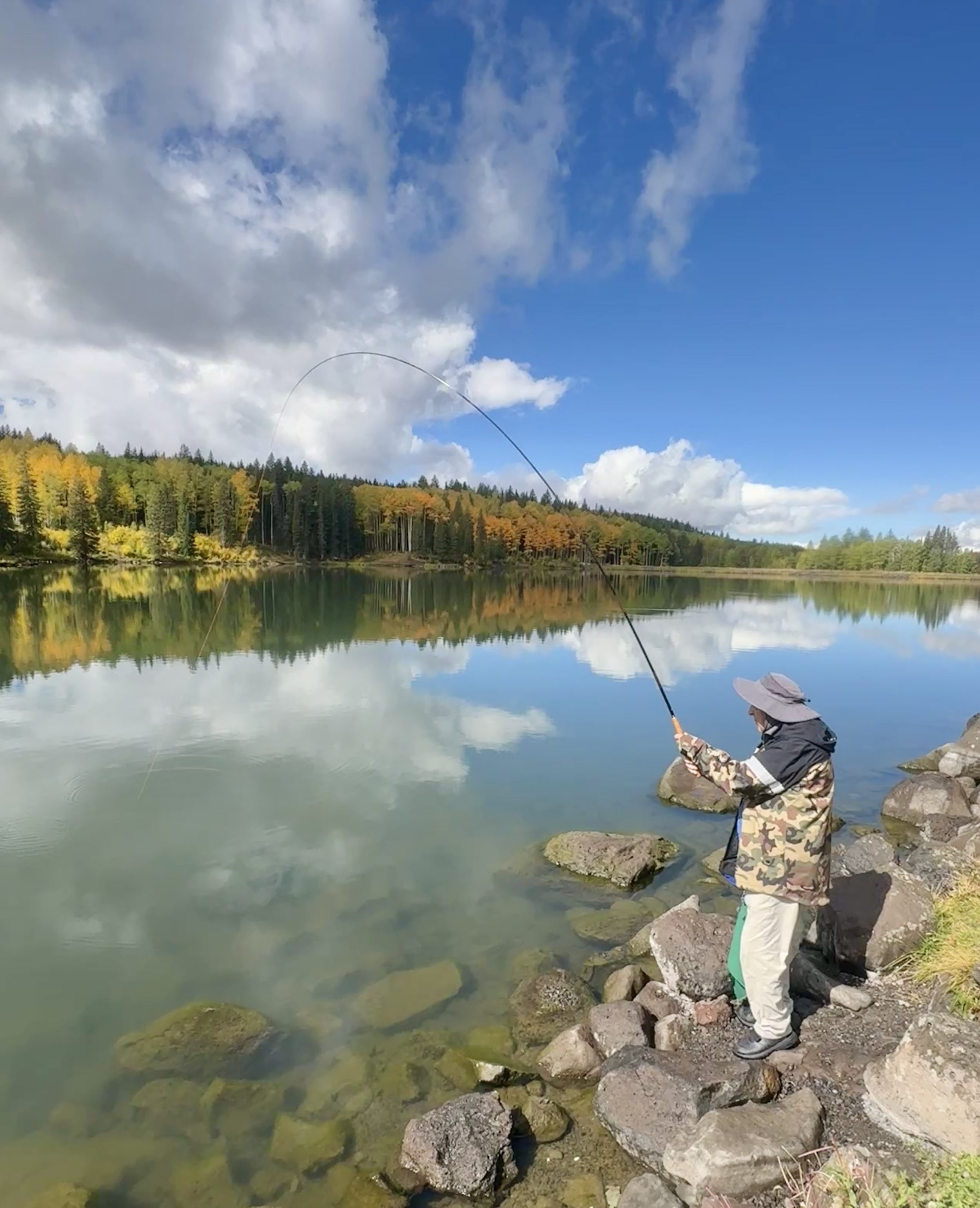 Man using a Tenkara fly rod for fishing