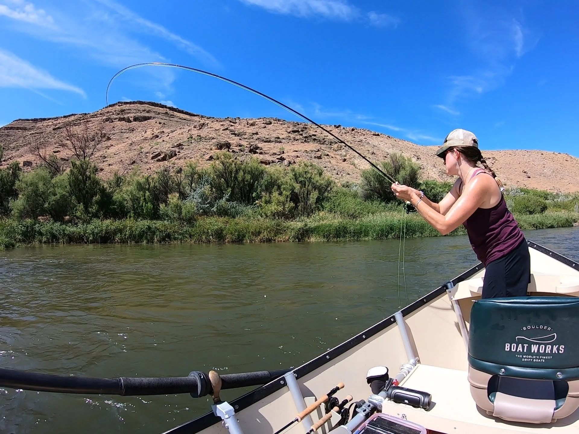 woman fly fishing on the river