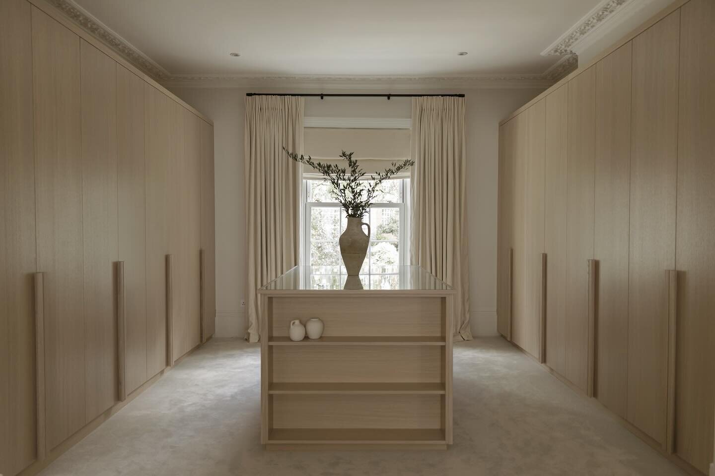 Is there anything better than a fully organised wardrobe in January? Well, what about a fully reconfigured and redesigned dressing room?! 

We designed custom built in wardrobes and a large central island, in beautiful light, calming tones to ensure 