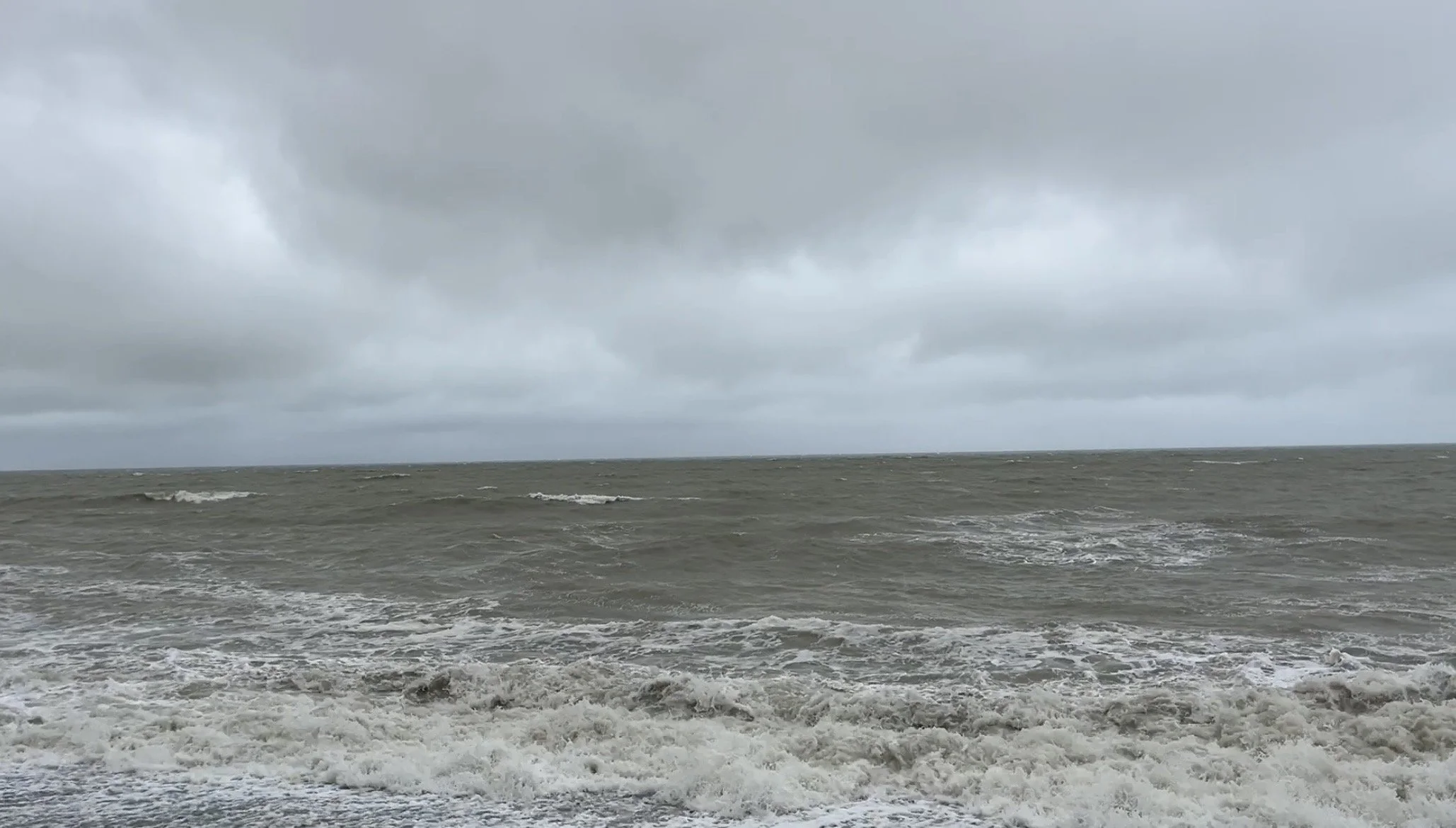 Stormy ocean waves symbolizing emotional overwhelm and the experience of emotional dysregulation.