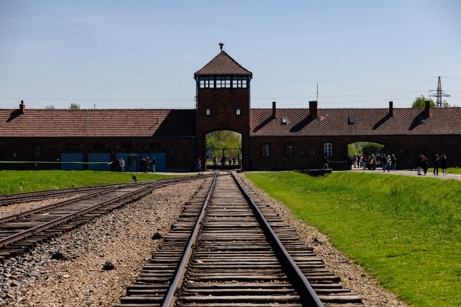 Railway tracks leading to the entrance gate of Auschwitz II-Birkenau Memorial and Museum in Oświecim, Poland