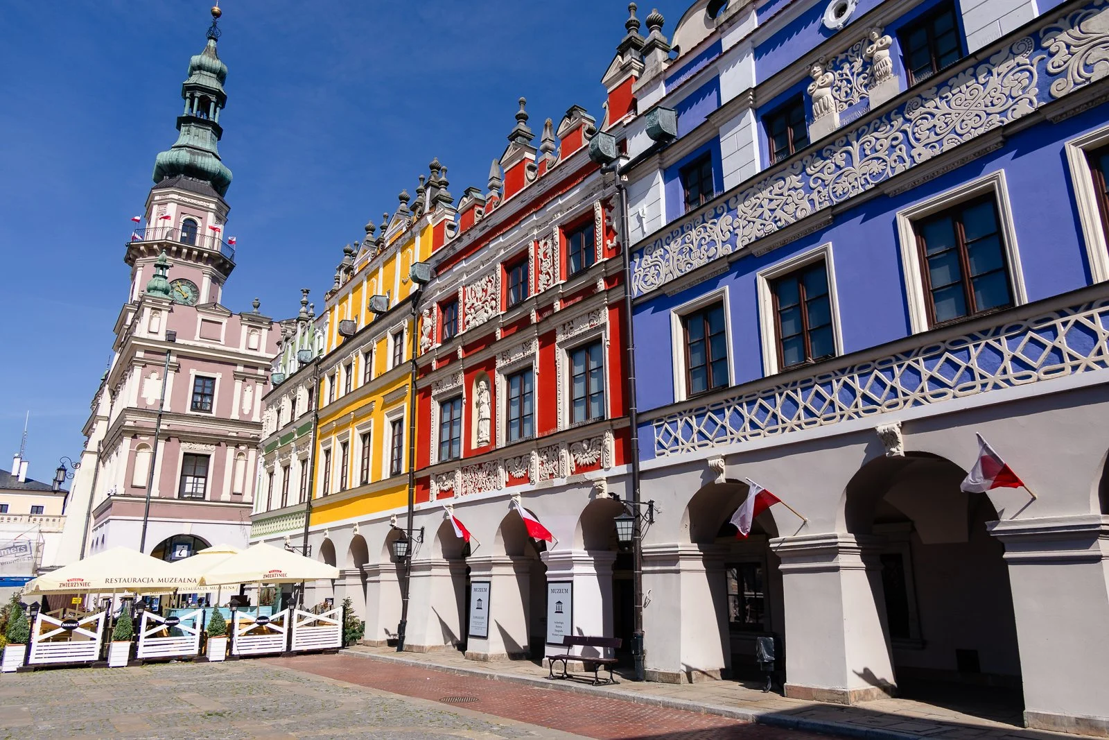 Colorful houses and the Historic Town Hall in Rynek Wielki (Great Market Square) in Zamosc, Poland
