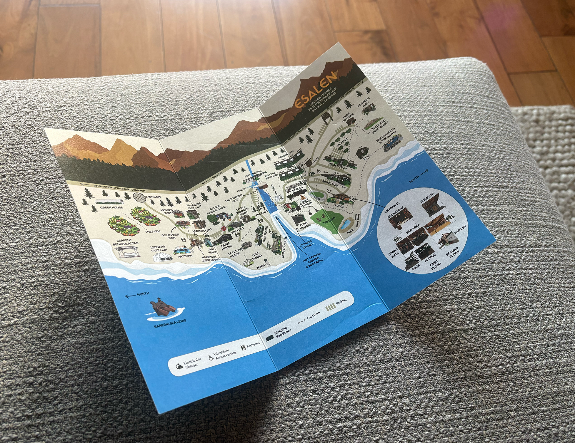 Esalen campus map trifold on couch in living room