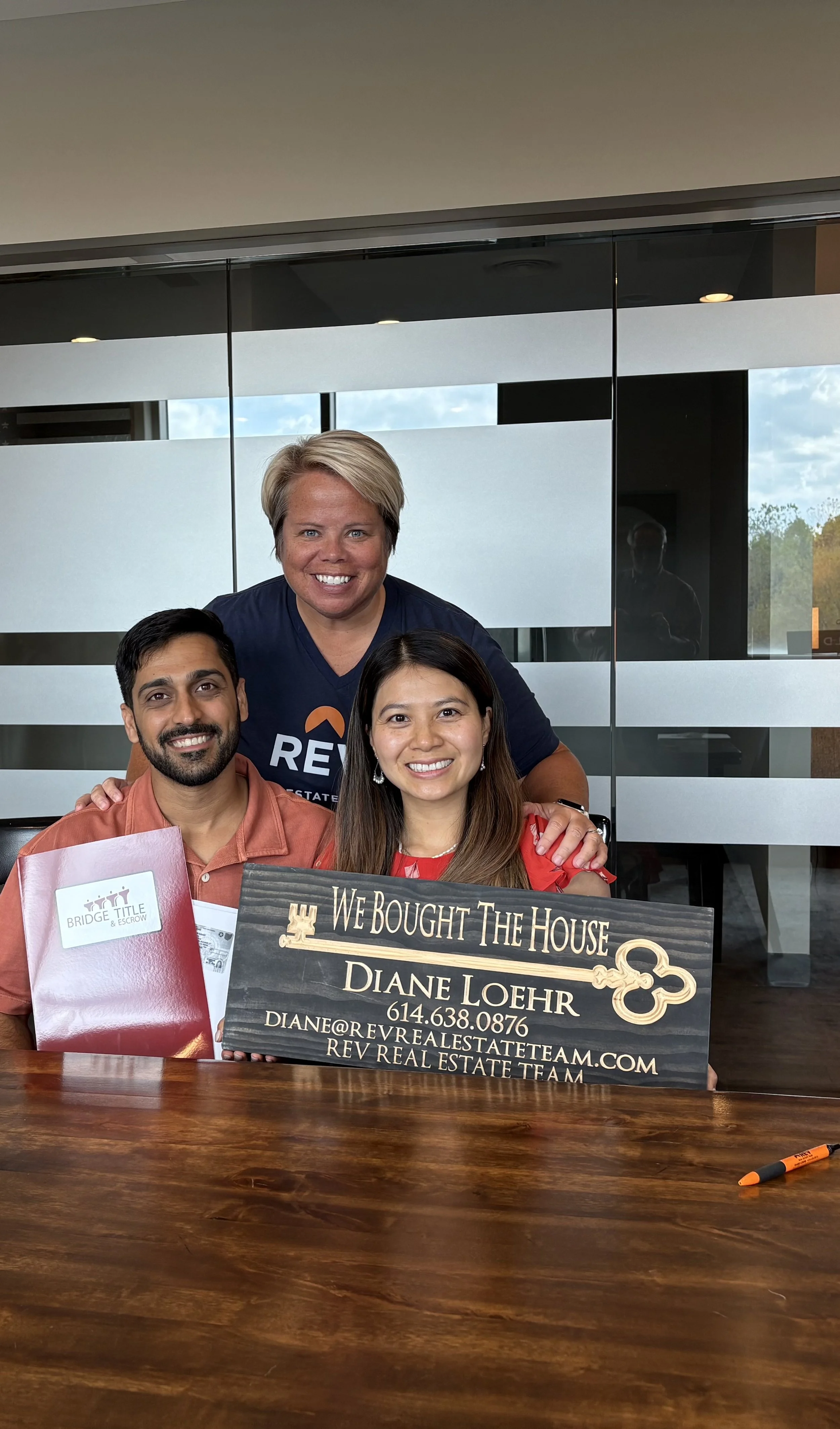 Happy clients completing their real estate closing with realtor Diane Loehr in Buckeye Lake, Ohio.