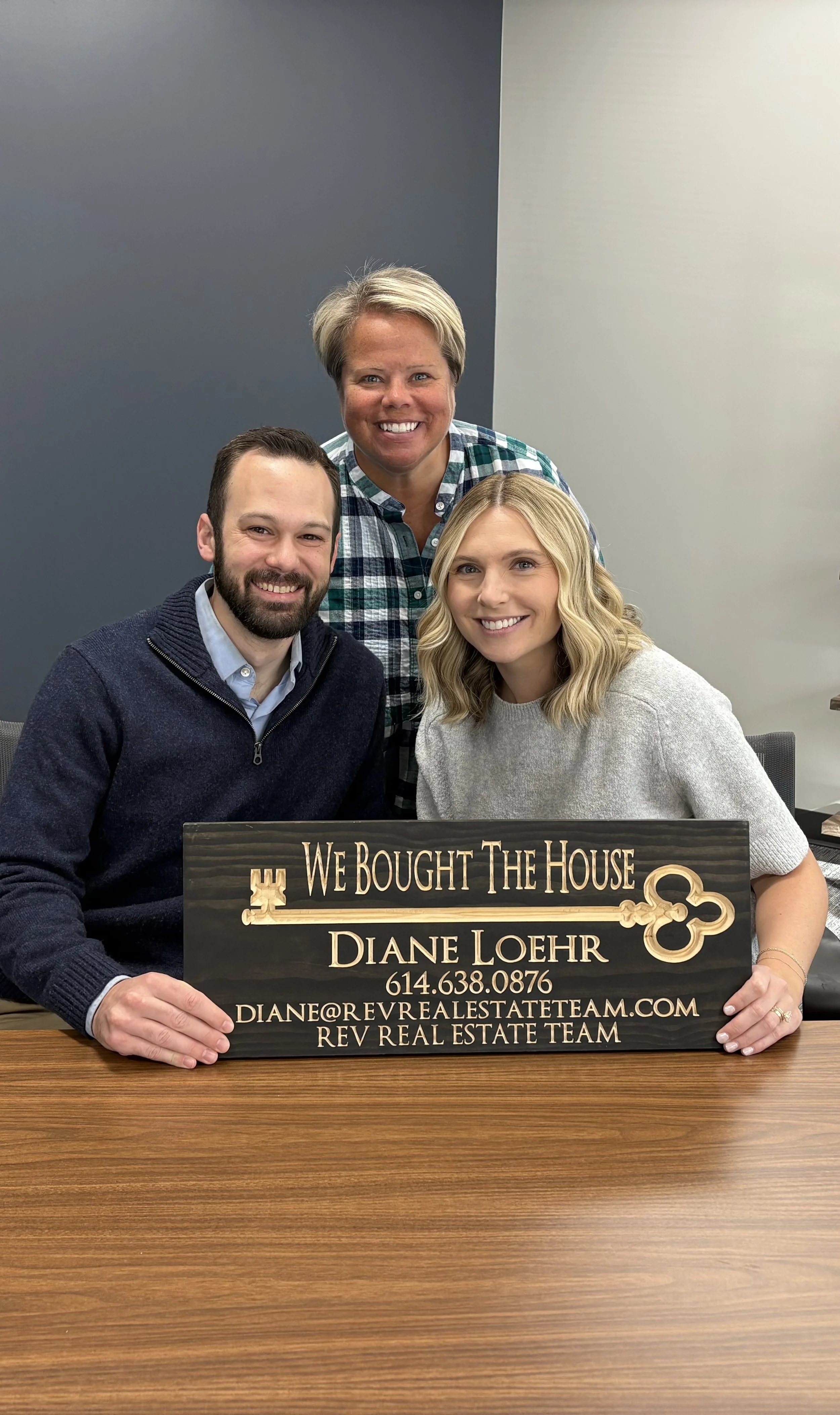 Realtor Diane Loehr with first-time homebuyers at the closing table signing final documents in Worthington, Ohio.
