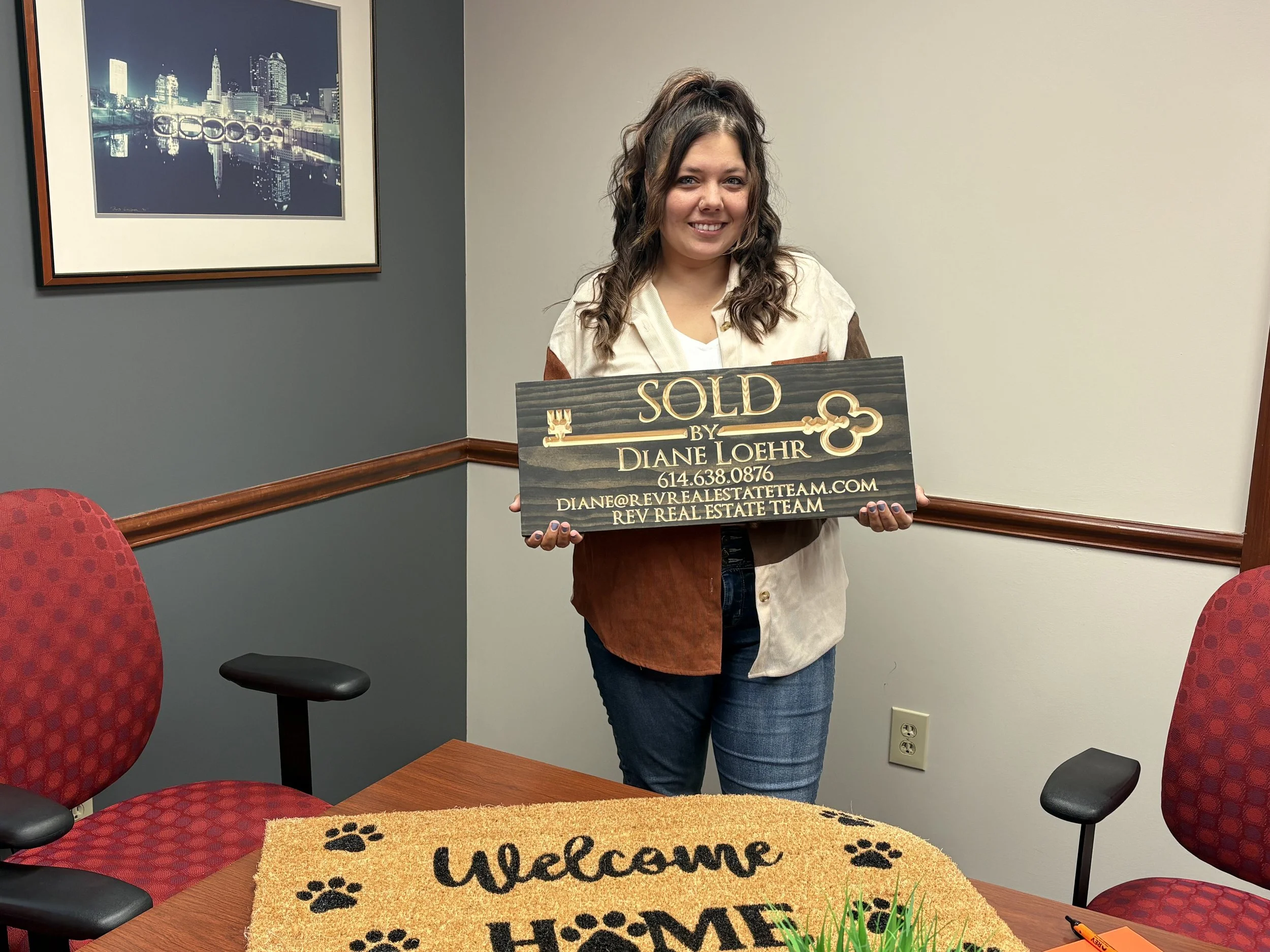 Successful real estate closing with experienced agent Diane Loehr and her client in London, Ohio.