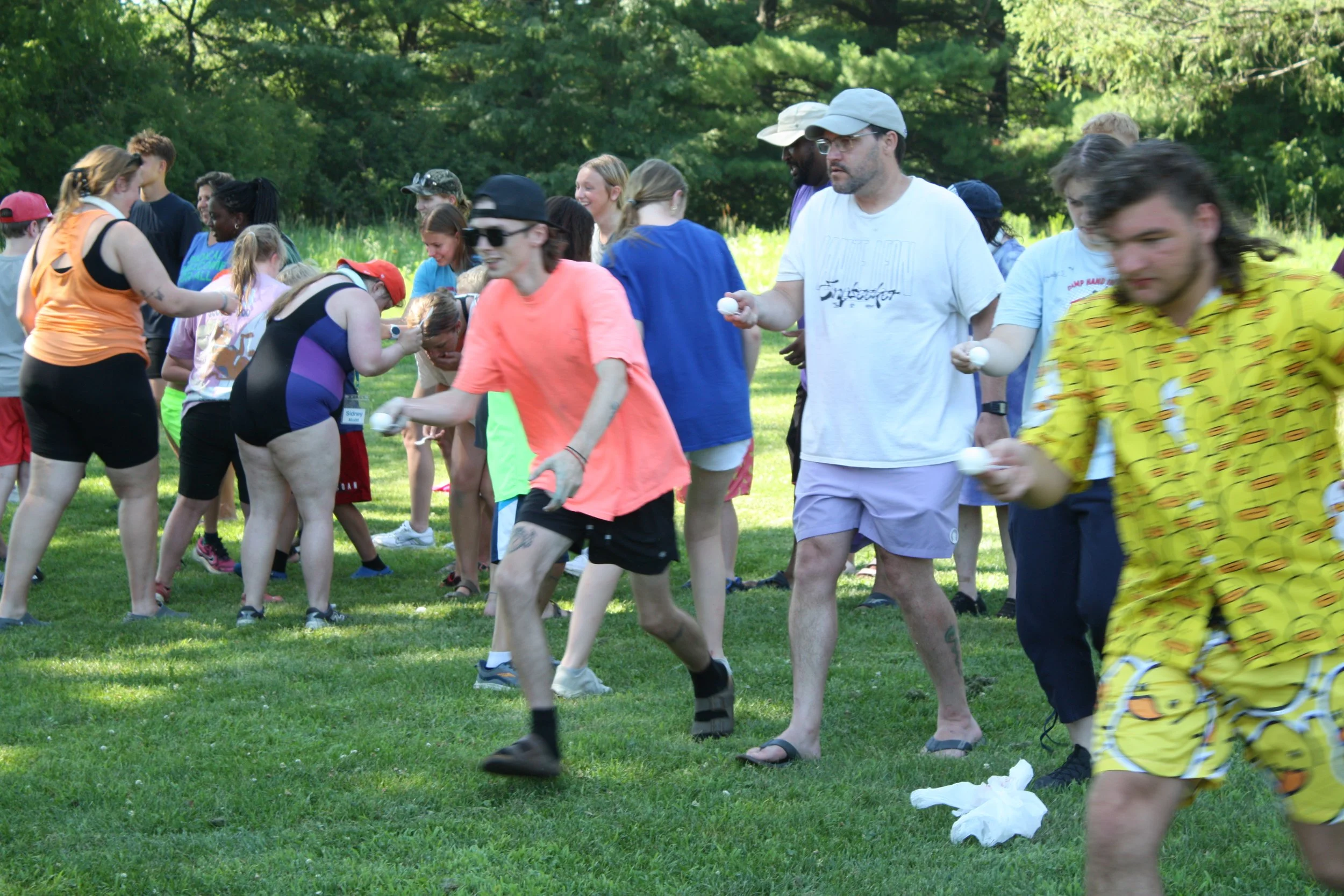 Tim participating in an egg race at camp