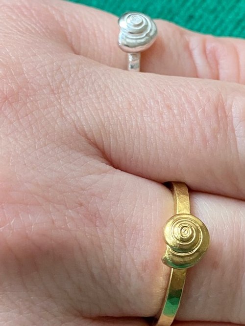 Rose Honey 2 spire shell rings hand.jpeg