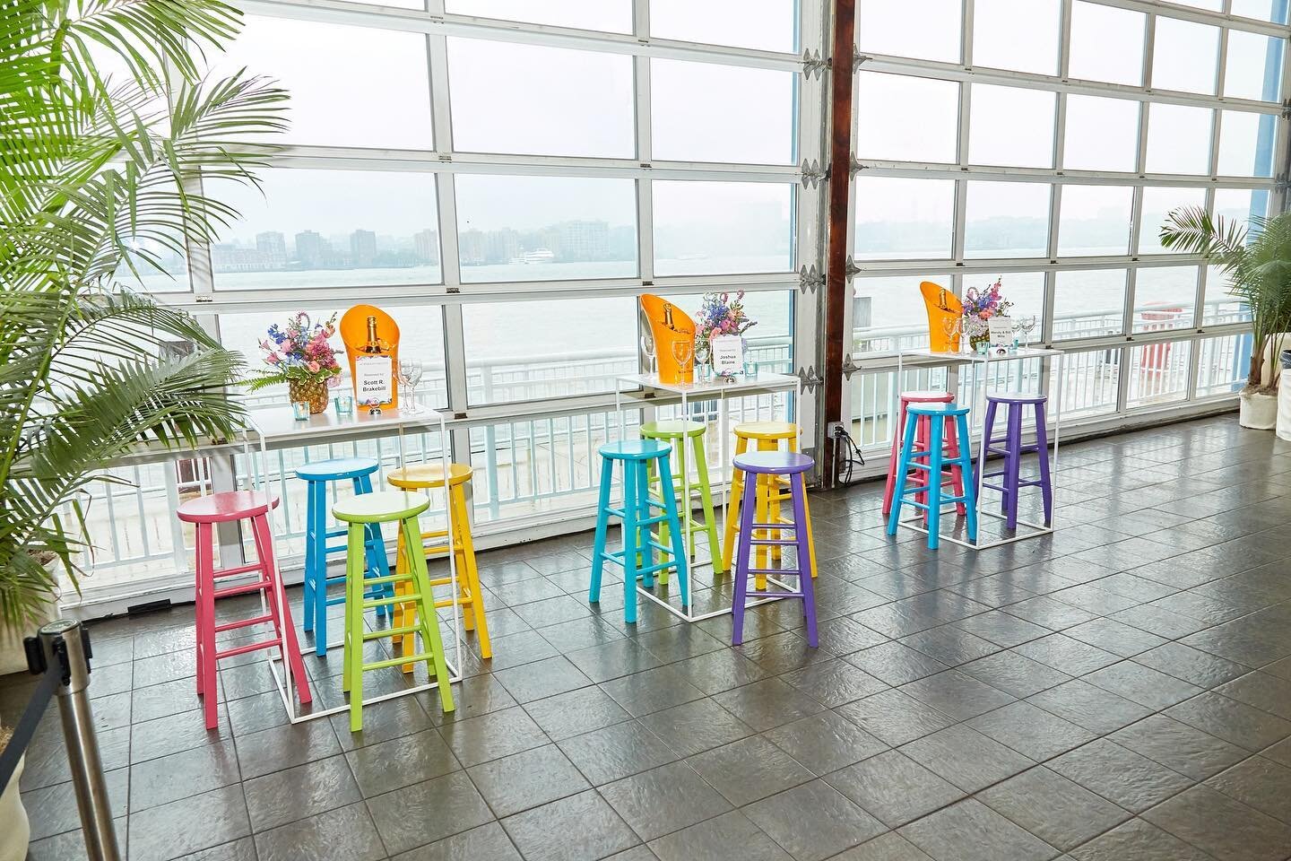 I know it&rsquo;s September 1st but it&rsquo;s still Summer and we are still embracing those bright summer tones at events.  Loved these neon barstools to complete the view of the water at The Lighthouse in NYC.⁠
⁠
Venue: @piersixty⁠
Design: @edlibby