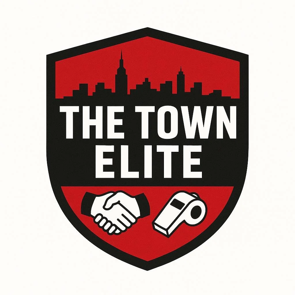 A shield-shaped logo with a city skyline at the top, the words "The Town Elite" in the center, a handshake icon on the left, and a handheld tape measure on the right.