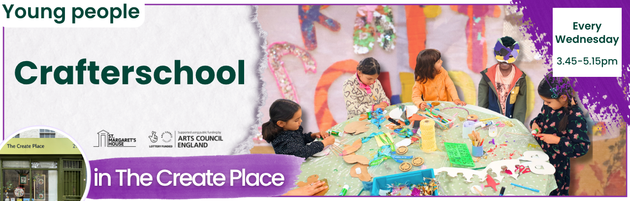 5 children sat round a green and white spotty table making masks. The 4th child along is wearing his mask, which is purple and yellow.