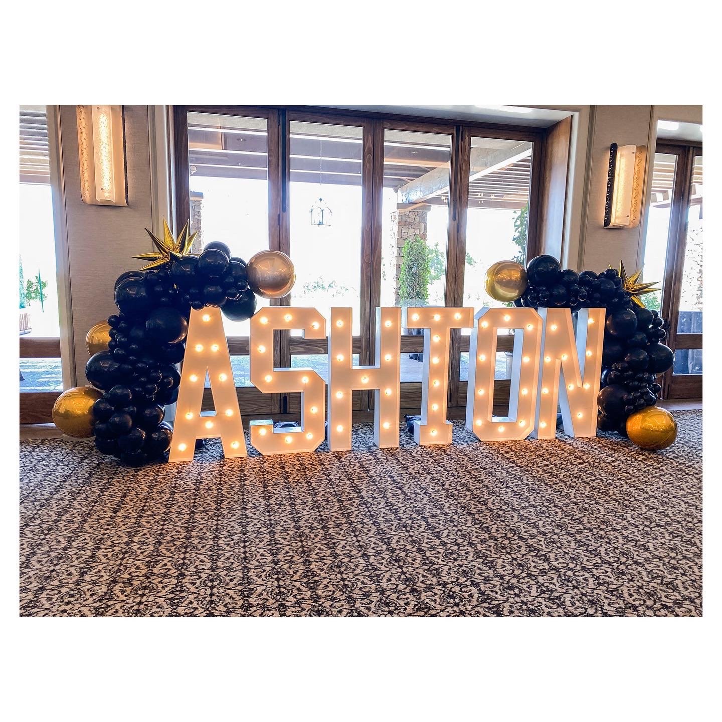Blackout gold accented marquee mini balloon garlands: $400+ (marquees not included)