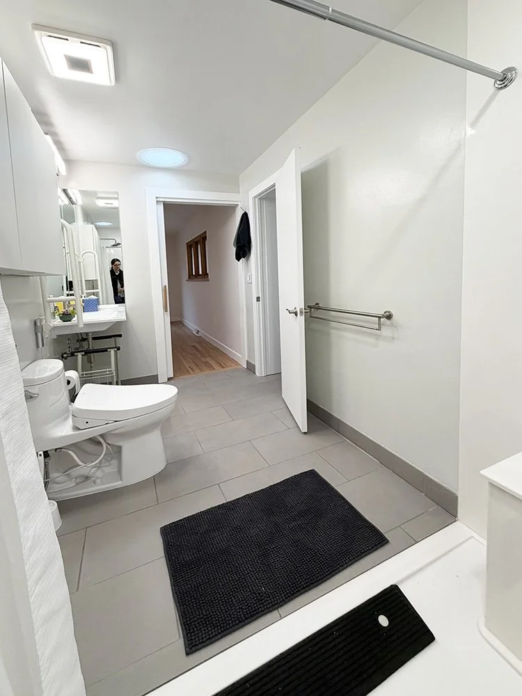 The primary suite bathroom also had two doors. One door is accessible and leads directly to the primary bedroom, the other is not accessible and leads to the laundry room.