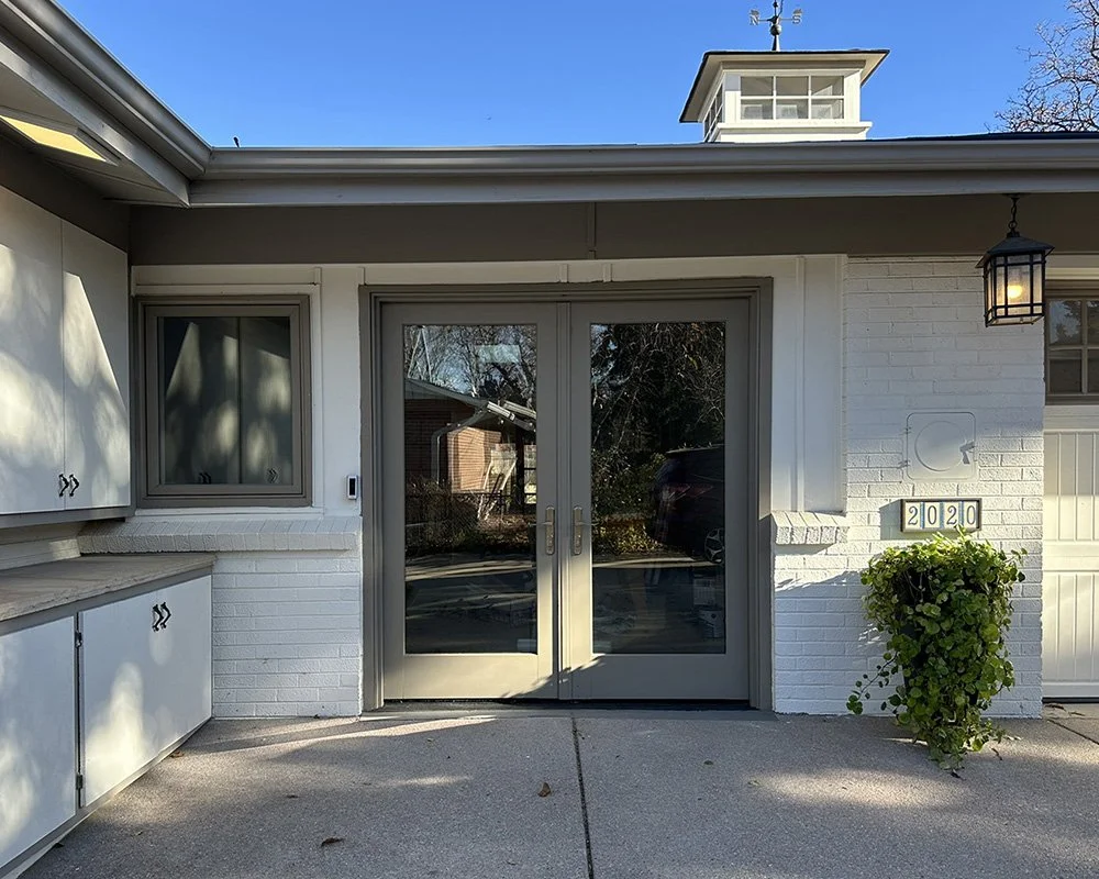 Entry from the driveway to the breezeway. No stairs and wide double doors.