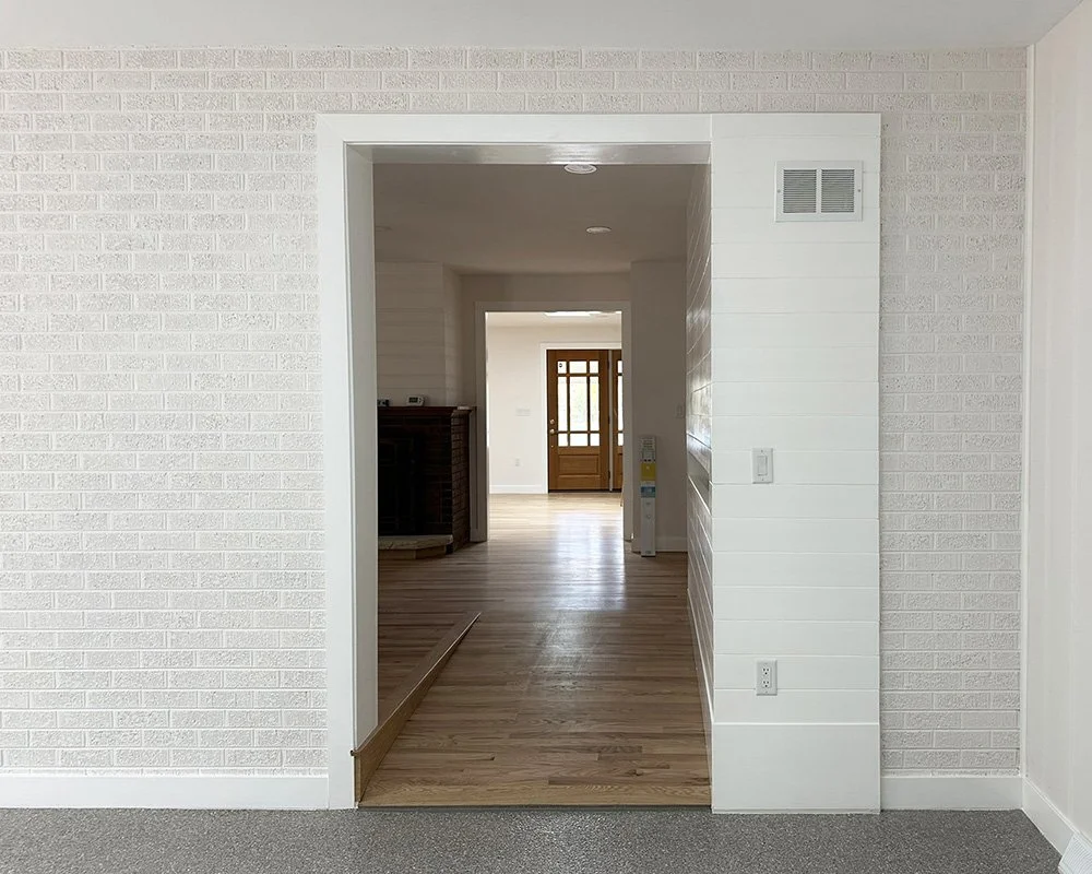 The ramp to the main house rises about 7"; front door to porch is beyond. 