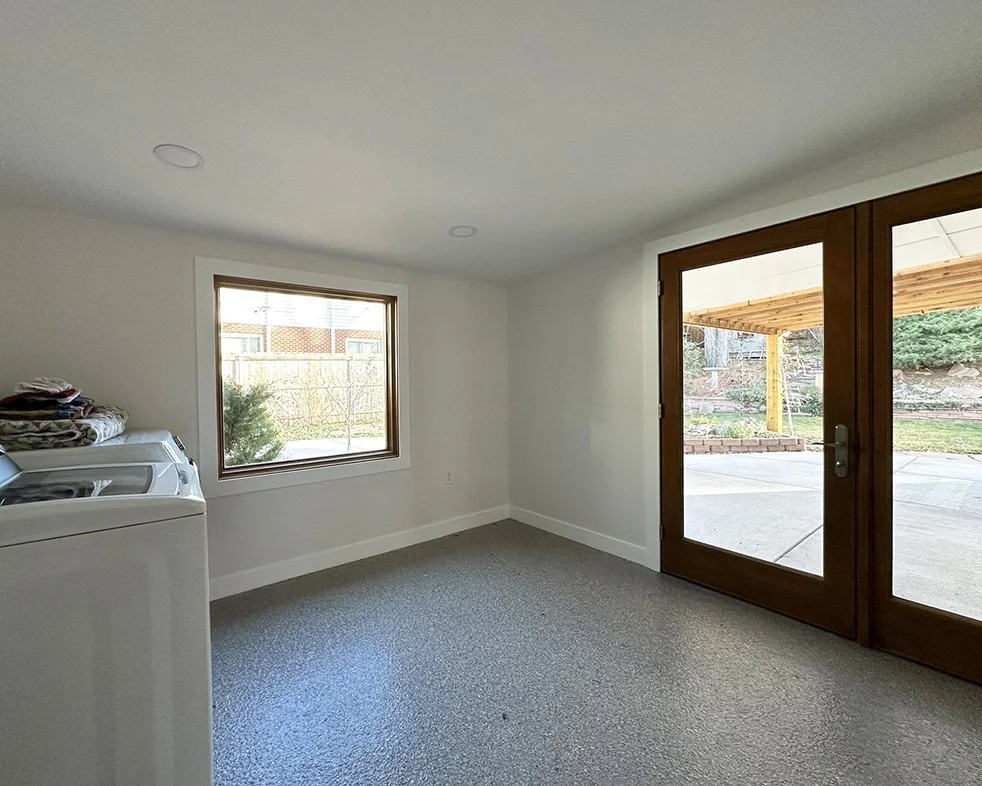 The laundry room is spacious enough to accommodate furniture or dry racks or mobility devices.  