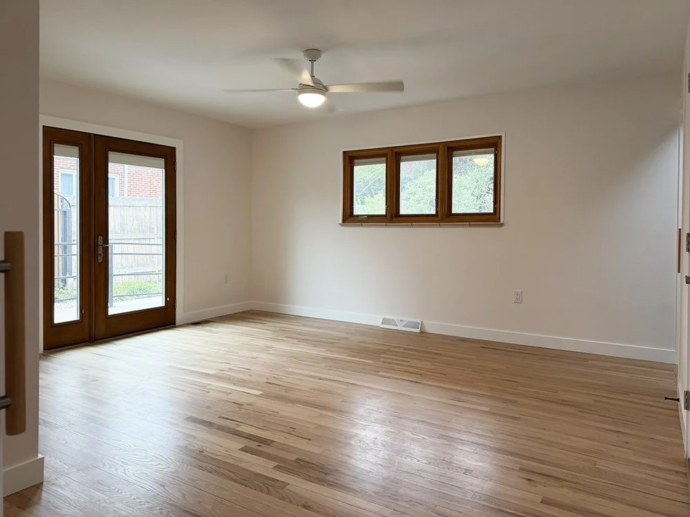 Primary Bedroom Suite. Enter via a pocket door from the hall. An exterior accessible door leads to the east porch. All the bedrooms have built-in blinds in the doors and windows. 