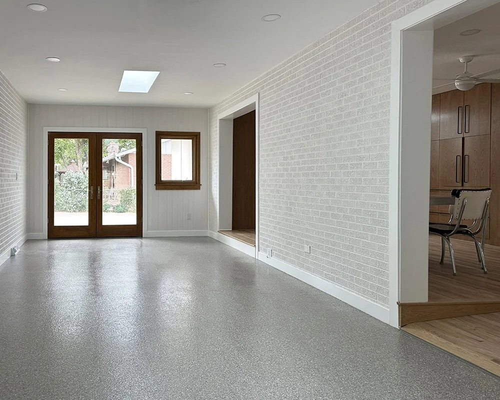 Ramp to main house on right. Primary entry to driveway through double wide doors.