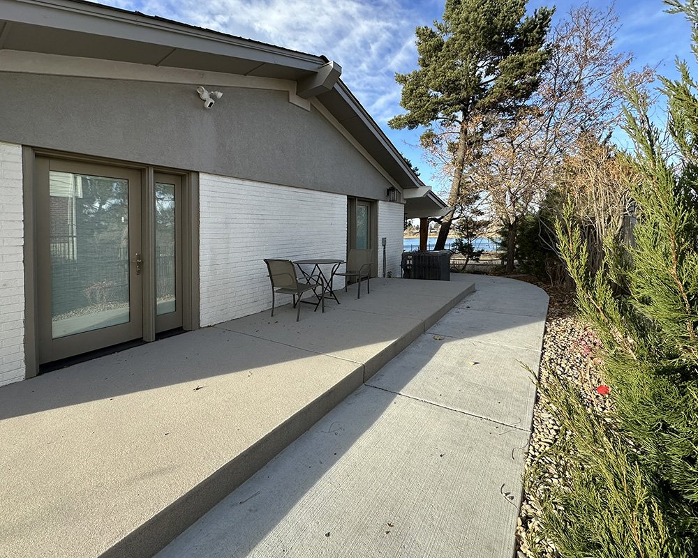 The east porch with direct access to bedrooms. A railing and privacy panel will be installed shortly. 