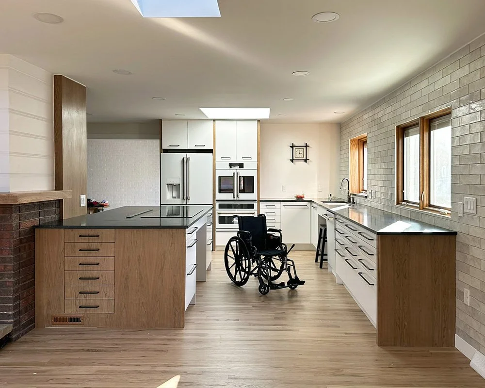 Kitchen with extra space for wheelchairs between counters. In fact, have you heard the expression "two-butt kitchen?" We think that this kitchen could pass as a "two-wheelchair kitchen." 