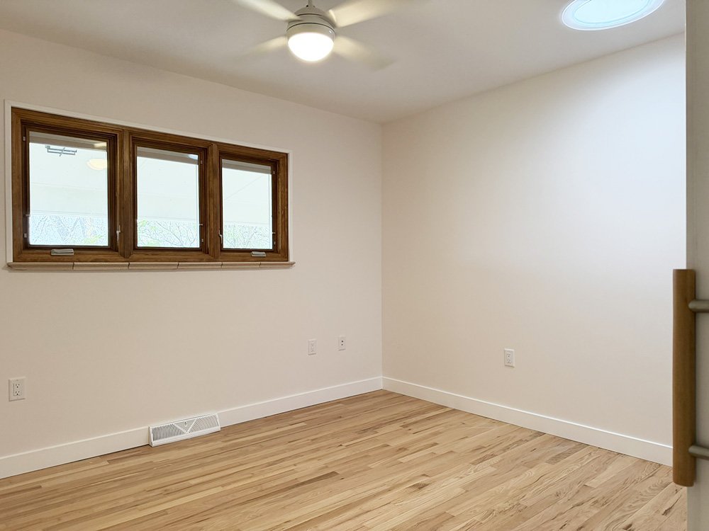 The first room is the smallest of the three bedrooms.