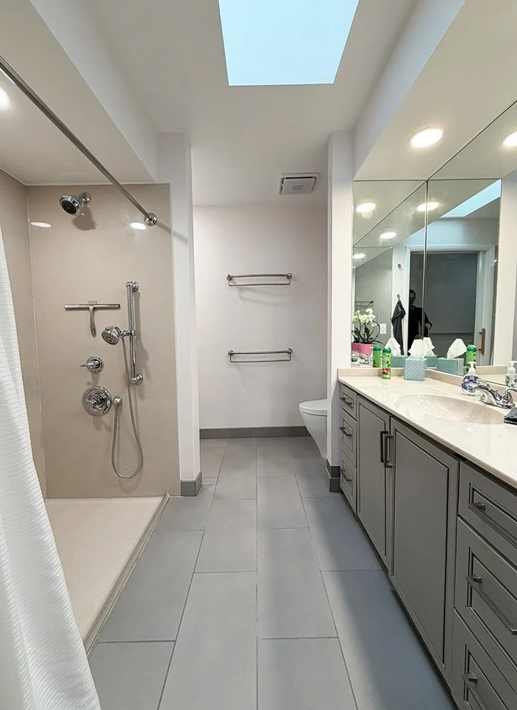 Enter the main bathroom from the hall. There is a roll-in shower on the left.