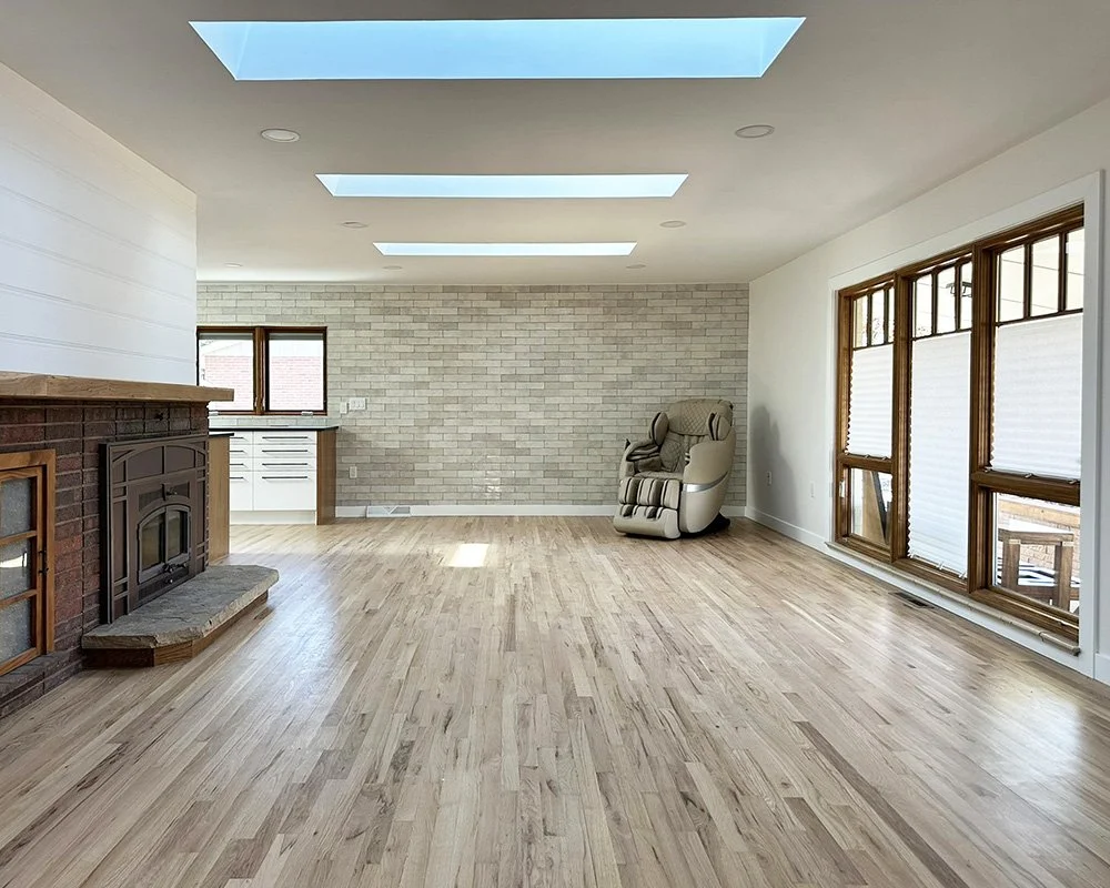 Large living room in the front of the house. The kitchen is tucked around the corner. There's a massage chair, if desired.