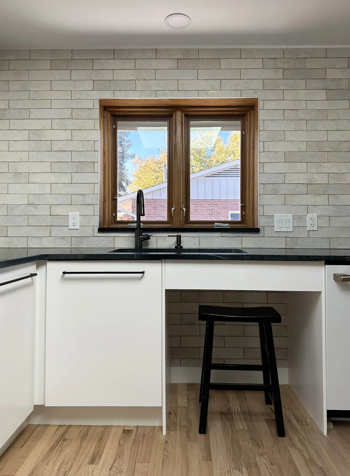 Counters are normal height, but roll-unders at the sink and cook top allow a power wheelchair with a lift to use the space. Or enjoy sitting on a stool while washing dishes. We off-set the sink so that there's still room for a garage disposal and pip