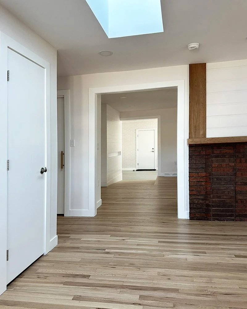 Entry sequence - from front door, down ramp, to garage door beyond.