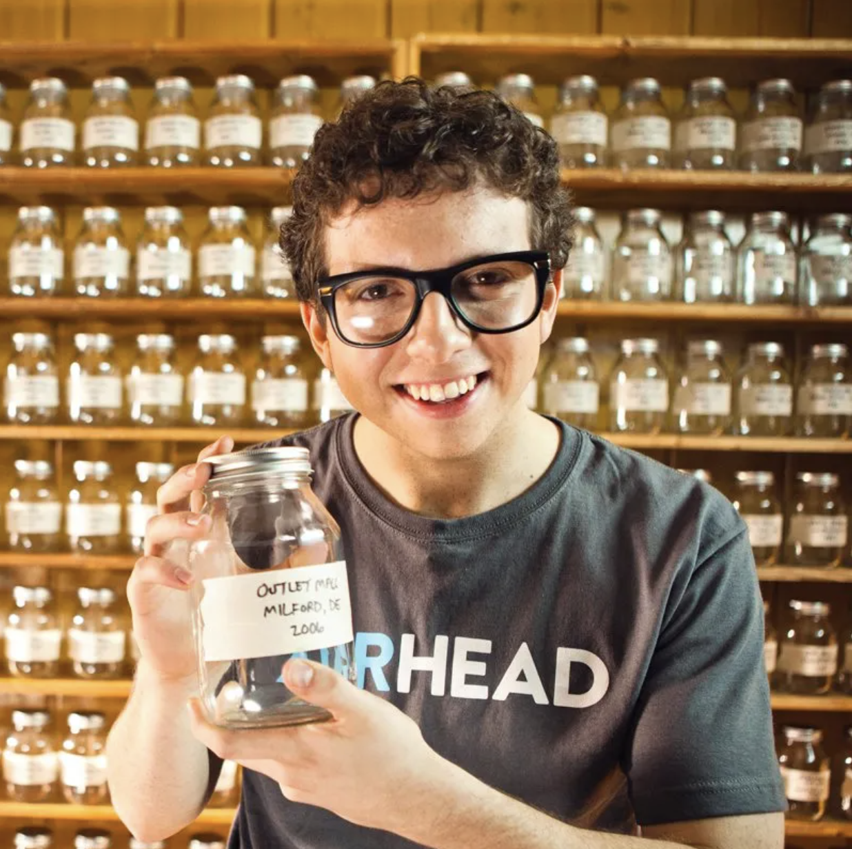 Max Ganet holding a mason jar of air as the Air Collector