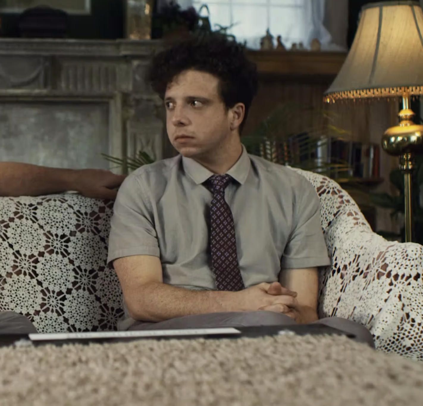 Max Ganet sitting looking to his left