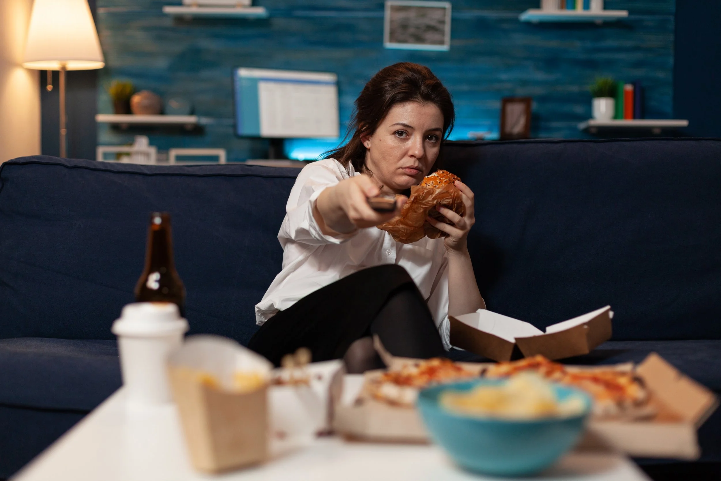 Woman experiencing compulsive eating and emotional food cravings
